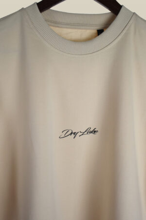 Oversized μπεζ μπλούζα DRYLAKE με μαύρη στάμπα στο στήθος